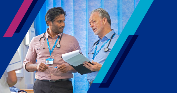 Two male doctors having a discussion in a medical setting