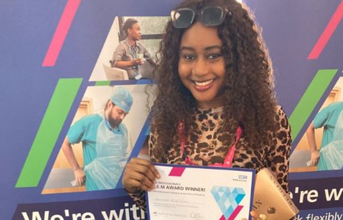 Aishah Chaudhri​ from Royal Berkshire NHS Foundation Trust holding her GEM Awards prize.